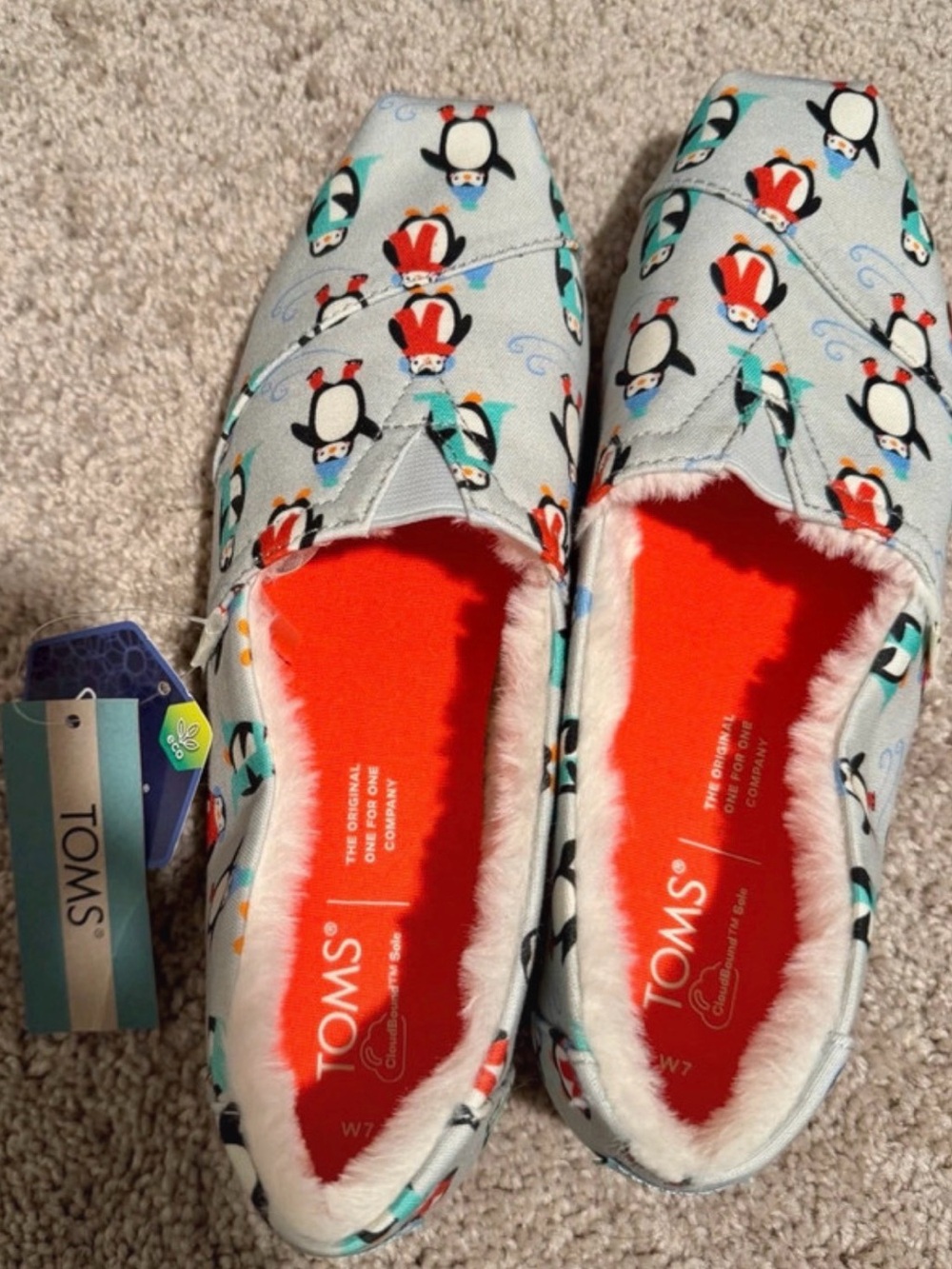 TOMS Light Blue Penguin Print Slip-On Kids Shoes with Orange Insole